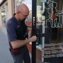 Brady's Locksmith checks the new key for a commercial lock at a business